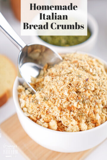 A bowl of Homemade Italian Bread Crumbs with a metal scoop in it.