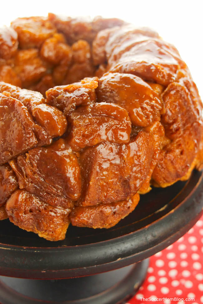 monkey bread made from pieces of biscuit dough, on a cake platter.